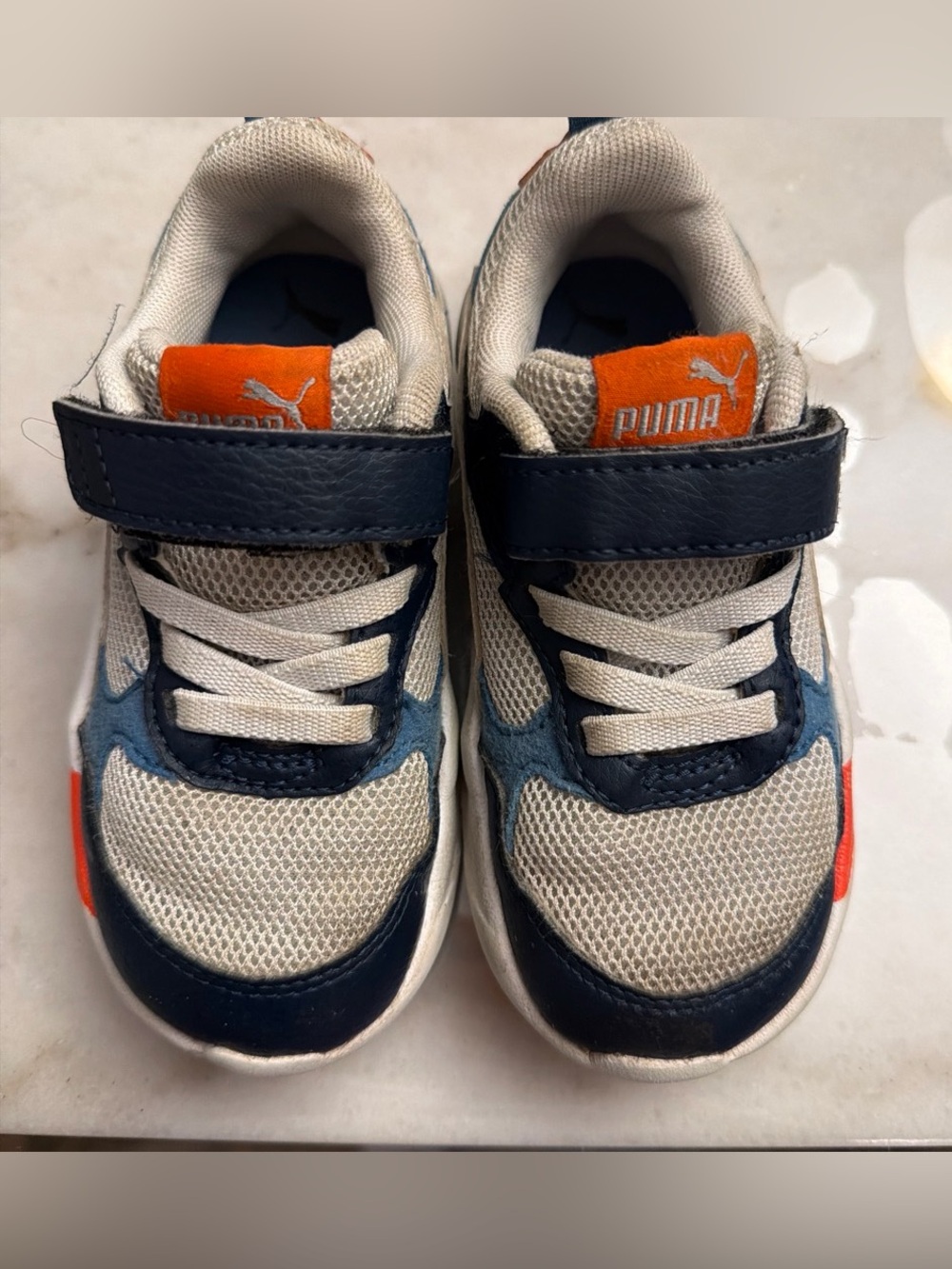 Puma Kids White and Navy Sneakers with Orange Logo Accent